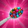 Silver blinged-out ice cream scoop spoon with colorful jewel-toned beads on a hot pink glitter background